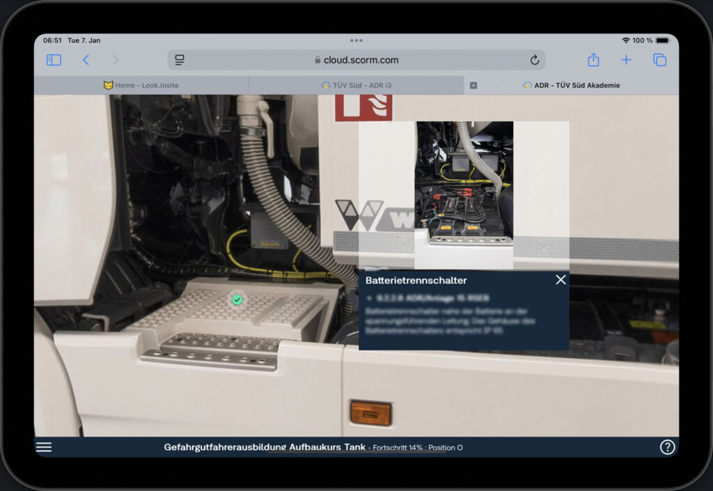 Tablet view of the battery switching unit on the fixed-wheel base dangerous goods truck, showing the info panel and exposed battery after removing the cover.